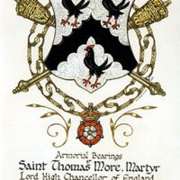 By Peter Drummond-Murray, Slains Pursuivant of Arms. Courtesy of W. David Holliday. Argent chevron engrailed between three moorcocks sable. Argent refers to the metal silver (Latin, argenturn), represented in heraldry by the color white. A chevron is an heraldic device shaped like an inverted V. Engrailed means indented along the edge with small curves. The moorcock is a pun on the name "More." Sable in heraldry refers to the color black.